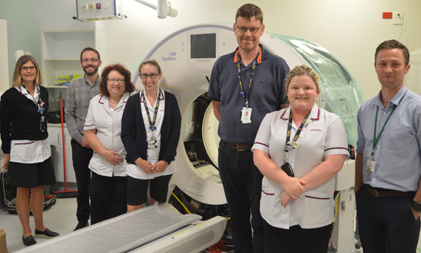 Radiology team with the new CT scanner.